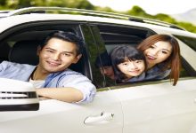Happy,Asian,Family,Traveling,By,Car,Looking,At,Camera,Smiling.
