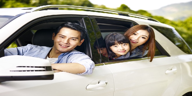 Happy,Asian,Family,Traveling,By,Car,Looking,At,Camera,Smiling.
