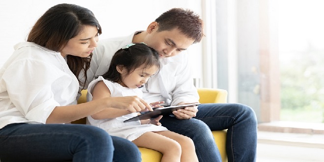 Asian family happy on the bedroom in the house with sunlight fro