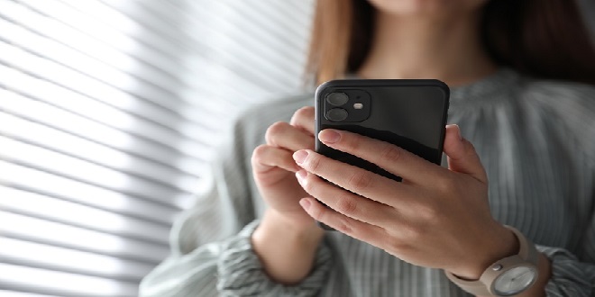 MYKOLAIV, UKRAINE - MARCH 16, 2020: Woman holding iPhone 11 Blac