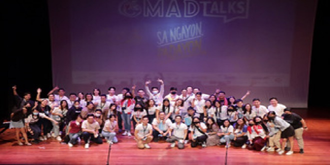 The volunteers of I am M.A.D. (Making A Difference) pose for a souvenir photo