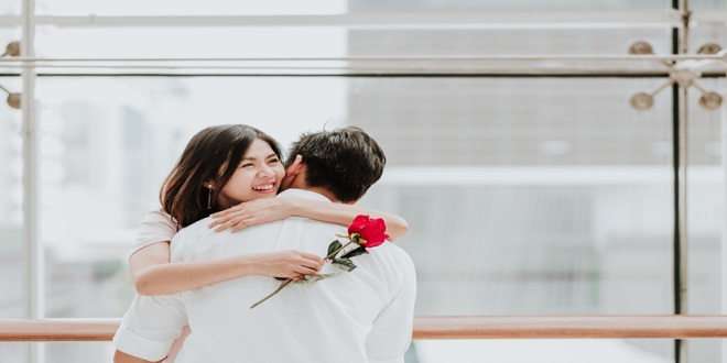 Happy,Beautiful,Young,Asian,Woman,Embracing,Her,Boyfriend,After,Receive