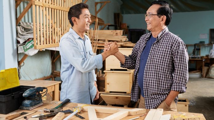 Cheerful Vietnamese carpenters Cheerful Vietnamese carpenters